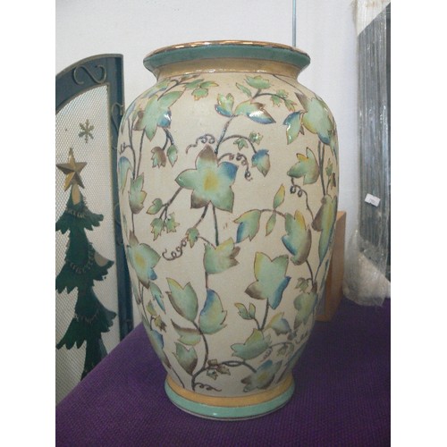 114 - LARGE CERAMIC VASE WITH IVY LEAF DESIGN ON SAND.