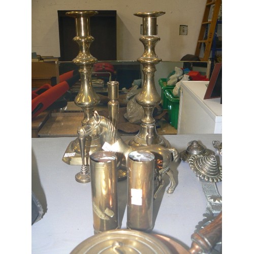 332 - VINTAGE BRASSWARE, INC 2 CANDLESTICKS, 2 SHELL CASES, HORSES, AND HORSE BRASSES ETC ETC.