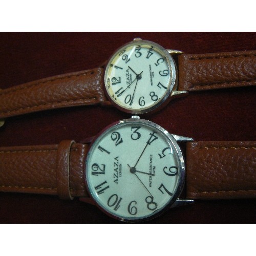 30 - A PAIR OF AZAZA LONDON WATCHES HIS AND HERS BOTH UNWORN WITH BROWN LEATHER STRAPS