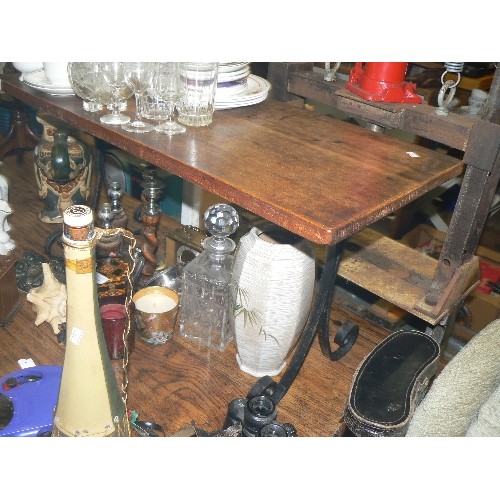 419 - SMALL WOODEN TABLE ON WROUGHT IRON LEGS.