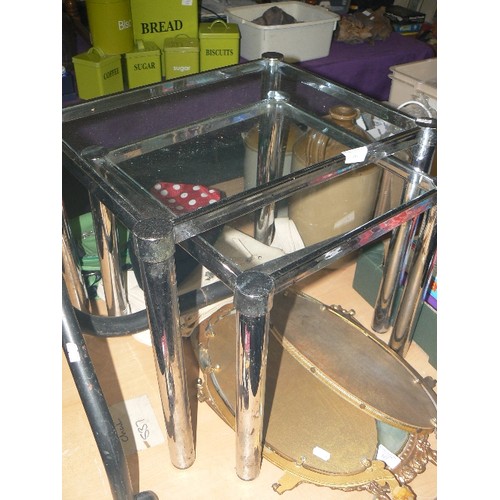 167 - NEST OF 2 METAL TABLES WITH GLASS TOPS.