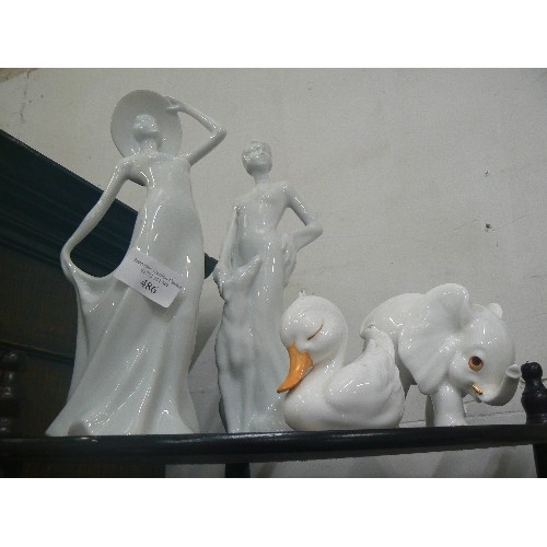 338 - WHITE PORCELAIN ORNAMENTS, A DECO STYLE FIGURE, AN ELEGANT LADY, AN ELEPHANT AND A DUCK.