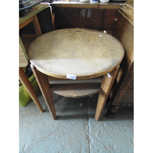 348 - CIRCULAR SIDE TABLE WITH TAPERED OAK LEGS. PLY TOP & LOWER SHELF.