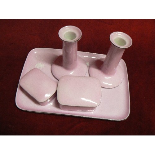 73 - CHINA DRESSING TABLE SET IN DUSKY PINK. 2  CANDLESTICKS, 2 LIDDED POTS ON A TRAY.