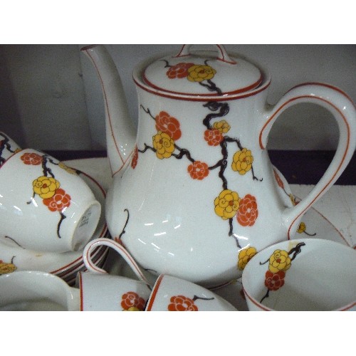 84 - LIMOGES L.BERNADAUD & Co. PRETTY BLOSSOM TEA-SET. TOGETHER WITH AN OVAL SERVING DISH. HAIRLINE CRACK... 