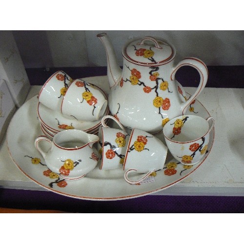 84 - LIMOGES L.BERNADAUD & Co. PRETTY BLOSSOM TEA-SET. TOGETHER WITH AN OVAL SERVING DISH. HAIRLINE CRACK... 