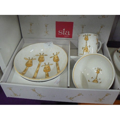 85 - 'SIA KIDS' CHRISTENING SET. GIRAFFE DESIGN. APPEARS UNUSED AND WITH BOX.