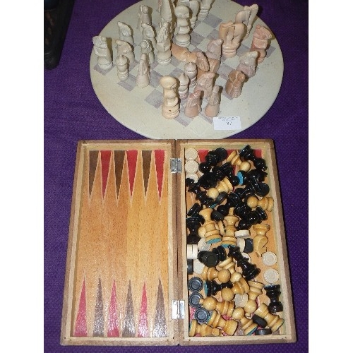 87 - SOAPSTONE CHESS BOARD & SET[SOME NIBBLES], TOGETHER WITH SMALL WOODEN CHESS & BACKGAMMON PIECES IN A... 