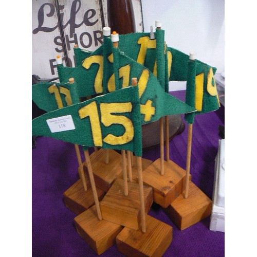 118 - SET OF GREEN FELT NUMBER FLAGS ON WOODEN BLOCKS.