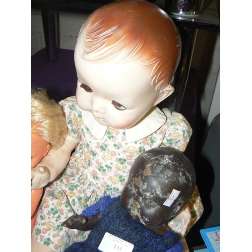 155 - VINTAGE DOLL BY PEDIGREE-ENGLAND, A BLACK BAKELITE DOLL WITH SOME DAMAGE AND A PLASTIC DOLL.