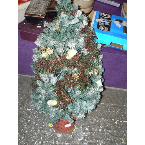 183 - WALL-MOUNTED FAUX CHRISTMAS TREE, WITH WICKER BASKET BASE.