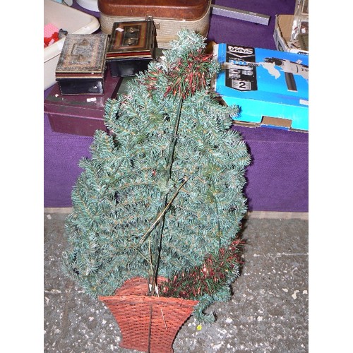 183 - WALL-MOUNTED FAUX CHRISTMAS TREE, WITH WICKER BASKET BASE.