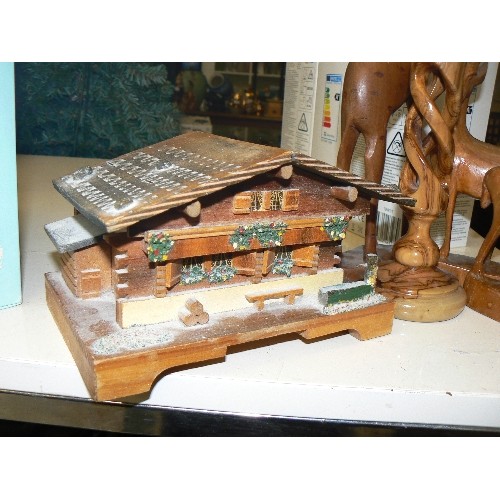 191 - TREEN. WOODEN SWISS CHALET/LOG CABIN- MUSIC BOX, WITH CARVED CANDLESTICKS & SET OF STAGS. SOME ANTLE... 