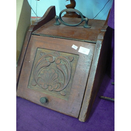 122 - WOODEN COAL BOX WITH CARVED FRONT PANEL. BRASS HANDLE.