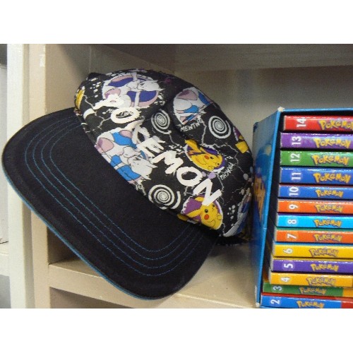 92 - POKEMON LOT. INCLUDES BASEBALL CAP, SMALL ALBUM OF TRADING CARDS, & BOXED SET OF 14 BOOKS.