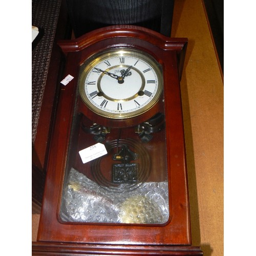 258 - WIND-UP STRIKING WALL CLOCK, WOODEN CASE, WITH KEY & PENDULUM.