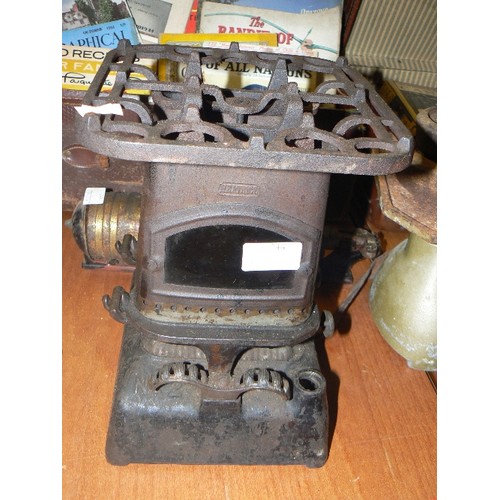 244 - TINY BEATRICE CAST IRON PARRAFIN STOVE, WITH TOP TRIVET.