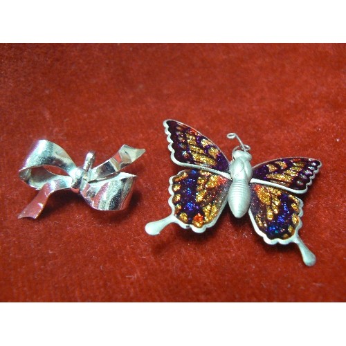 57 - 2 BROOCHES 1 SILVER AS BOW THE OTHER ENAMEL BUTTERFLY