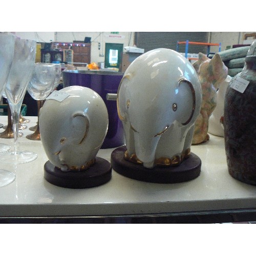 221 - PAIR OF CERAMIC WHITE AND GOLD ELEPHANTS, POSSIBLY BY NADAL.