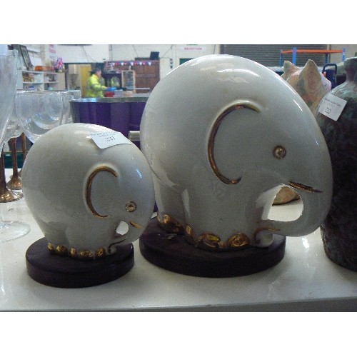 221 - PAIR OF CERAMIC WHITE AND GOLD ELEPHANTS, POSSIBLY BY NADAL.