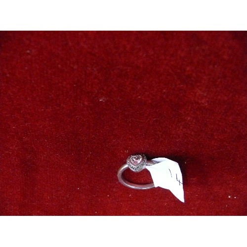 14 - A NICE SILVER RING WITH WHITE STONE IN HEART SHAPED SETTING