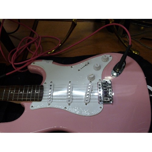 292 - STRATOCASTOR GUITAR BY SQUIRE AND PINK LEAD WITH ORIGINAL BOX, CARRY BAG AND PINK LEADS.  ALSO 'LEAR... 