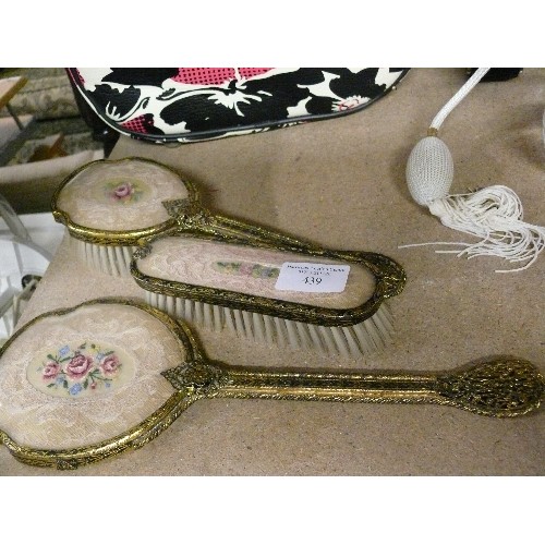 439 - A VINTAGE FILIGREE GILT LADIES DRESSING HAND MIRROR, MATCHING HAIRBRUSH AND CLOTHES BRUSH