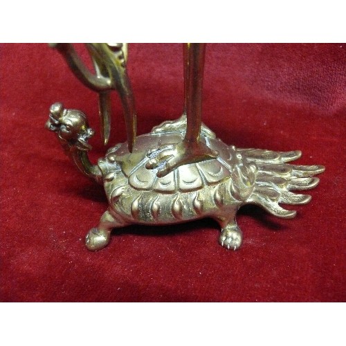 268 - PAIR OF DECORATIVE BRASS CANDLESTICKS DEPICTING A CRANE RIDING A DRAGON TORTOISE