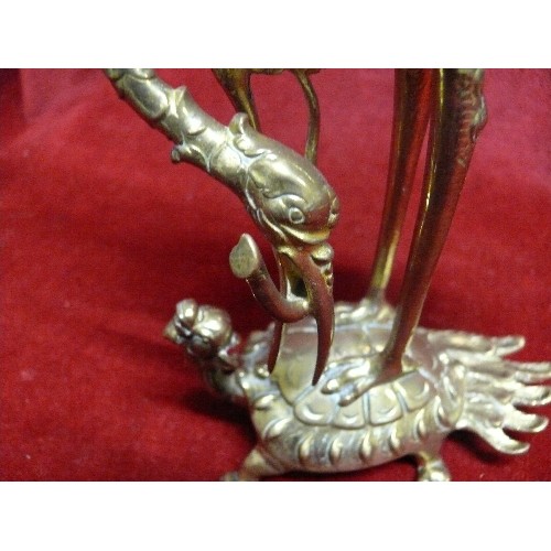 268 - PAIR OF DECORATIVE BRASS CANDLESTICKS DEPICTING A CRANE RIDING A DRAGON TORTOISE