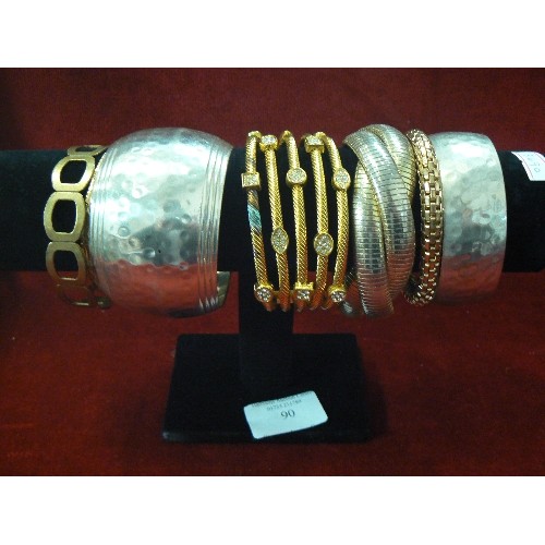 90 - TWO BRACELET STANDS WITH MANY DIFFERENT STYLED BRACELETS.