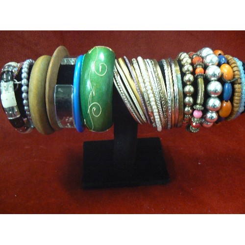 90 - TWO BRACELET STANDS WITH MANY DIFFERENT STYLED BRACELETS.