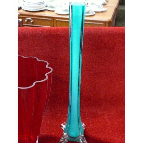 133 - LARGE HEAVY RED GLASS VASE PLUS TALL GREEN GLASS VASE.