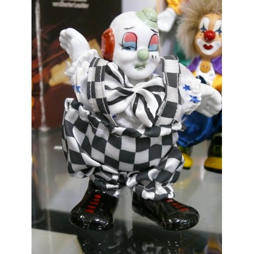 145 - COLLECTION OF PORCELAIN CLOWNS, SOME WITH BOXES.