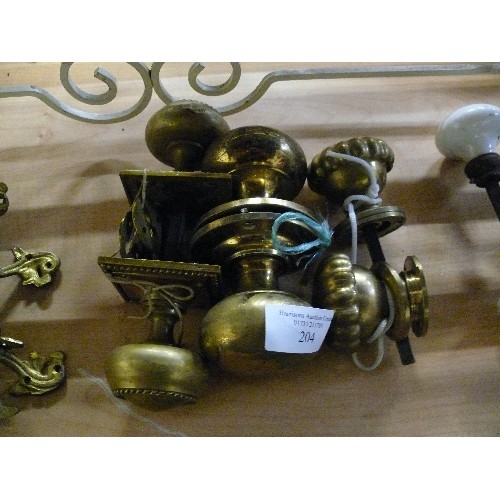 204 - THREE PAIRS OF DECORATIVE BRASS DOOR KNOBS.