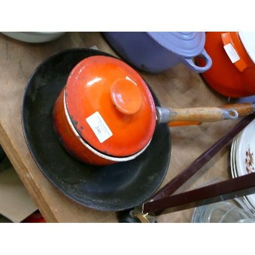 346 - TWO USED VINTAGE CAST IRON ITEMS - PAN WITH LONG WOODEN HANDLE AND A FRYING PAN.