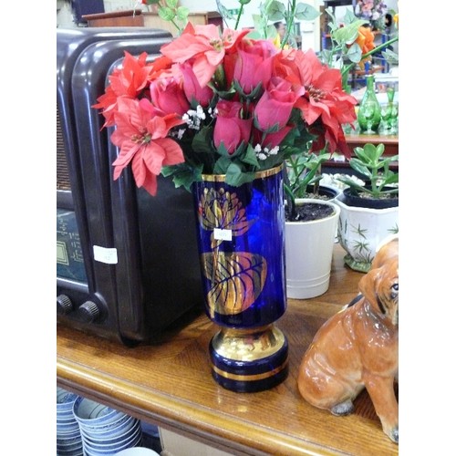 252 - LOVELY ARTIFICIAL ORANGE ROSE IN A CREAM POT ALSO ARTIFICIAL POINSETTIA IN A BLUE GLASS VASE WITH GI... 