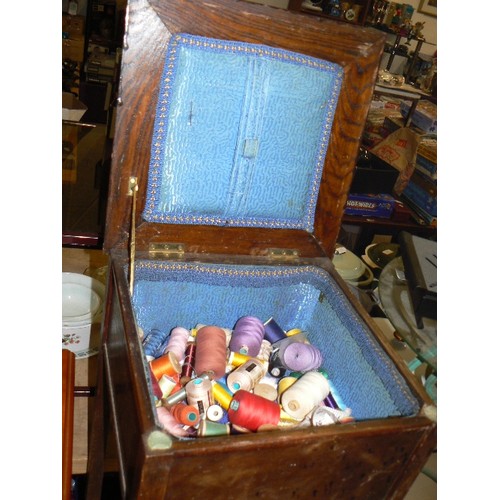 410 - VINTAGE SEWING BOX TABLE WITH CONTENTS OF THREADS AND SILKS.