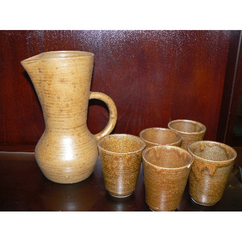 398 - FRENCH STONEWARE JUG AND FIVE MATCHING BEAKERS.