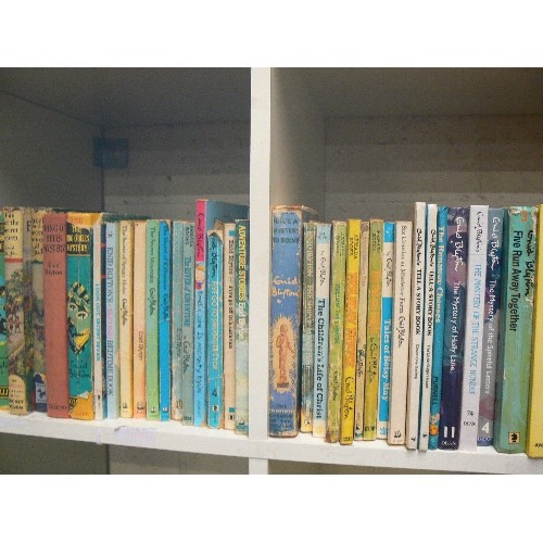 324 - FOUR CUBES OF VARIOUS VINTAGE ENID BLYTON BOOKS.