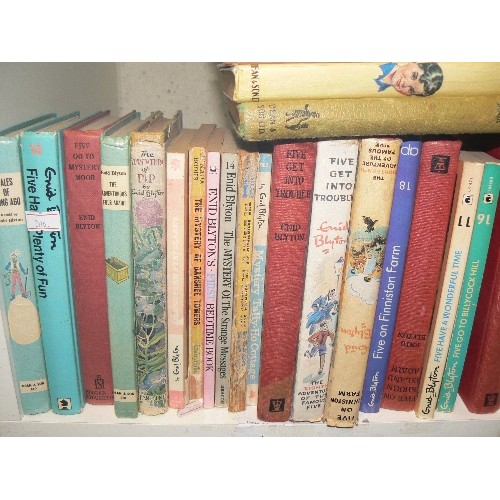 324 - FOUR CUBES OF VARIOUS VINTAGE ENID BLYTON BOOKS.