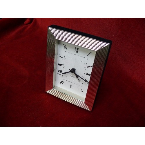 4 - A BEDROOM CLOCK  WITH SILVER METAL SURROUND.