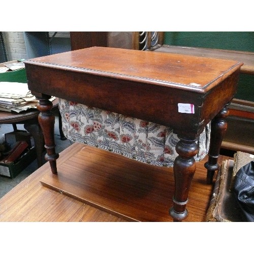 404 - A Victorian mahogany sewing box on turned legs with pleated fabric storage section