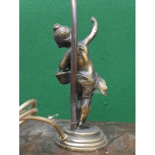 229 - An antique style table lamp - the base supported by a bronze metal figure of a child with basket of ... 