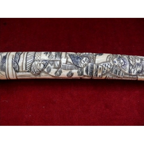 207L - A late 19th Century Japanese Tanto dagger with grip and sheath in carved bone with figures in tradit... 