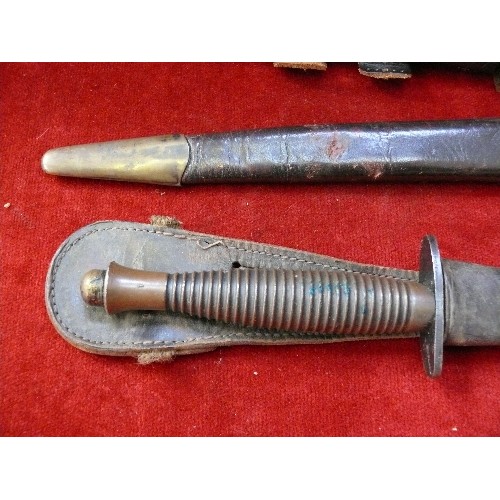 204D - Two WW2 British Commando knives, one with broad arrow mark between grip & blade. The third is a post... 