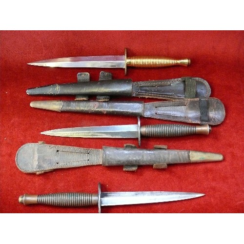 204D - Two WW2 British Commando knives, one with broad arrow mark between grip & blade. The third is a post... 