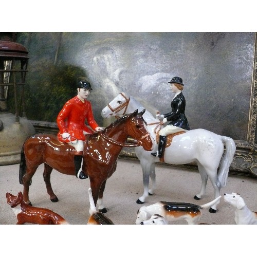 10 - A superb Beswick Hunting Group comprising Huntsman on bay horse, Huntswoman on dapple grey, five hou... 