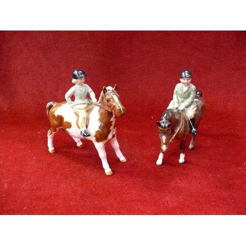 11 - Beswick boy on brown horse and a girl on a skewbald pony (No 1499) - both in very good condition