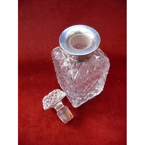 43 - A good quality cut crystal spirit decanter with silver collar hallmarked London 1959. Matching stopp... 