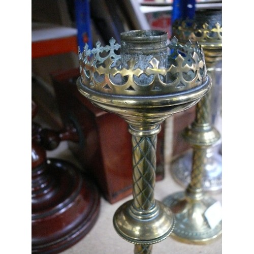 137 - A pair of Victorian Gothic candlesticks in brass, in the style of Augustus Pugin - 28cm